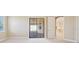 Bright bedroom with backyard access, neutral decor, and seamless flow to indoor and outdoor living at 15698 Marina Bay Dr, Winter Garden, FL 34787
