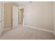 Neutral bedroom with carpet and view to hallway at 15698 Marina Bay Dr, Winter Garden, FL 34787