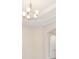 Open dining room featuring decorative lighting, tray ceiling, and access to doorways at 15698 Marina Bay Dr, Winter Garden, FL 34787