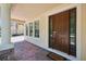 Inviting front entrance with a decorative wood door, brick pavers, and a welcoming 'Welcome' doormat at 15698 Marina Bay Dr, Winter Garden, FL 34787