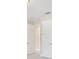 Hallway featuring neutral walls and carpeting with doors leading to other rooms at 15698 Marina Bay Dr, Winter Garden, FL 34787