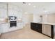 Open kitchen with stainless steel appliances, recessed lighting, and white cabinets at 15698 Marina Bay Dr, Winter Garden, FL 34787