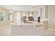 Bright kitchen features stainless steel appliances, stylish cabinets, a spacious island, and modern finishes at 15698 Marina Bay Dr, Winter Garden, FL 34787