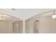 Interior view showcasing elegant archways, neutral color palette, recessed lights, and chandelier at 15698 Marina Bay Dr, Winter Garden, FL 34787