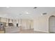 Spacious living room with tile floors and stainless steel appliances in the kitchen at 15698 Marina Bay Dr, Winter Garden, FL 34787