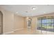 Bright living room with tile floors, recessed lighting and sliding glass doors with water view at 15698 Marina Bay Dr, Winter Garden, FL 34787