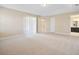 This main bedroom features neutral decor, a tray ceiling, and flows seamlessly to the bathroom area at 15698 Marina Bay Dr, Winter Garden, FL 34787