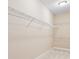 Bright walk-in closet featuring wire shelving, providing ample storage space at 15698 Marina Bay Dr, Winter Garden, FL 34787