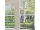 Windows with blinds allowing a view of the greenery outside at 15698 Marina Bay Dr, Winter Garden, FL 34787