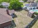 Aerial view of home's fenced backyard featuring shed and screened patio at 1606 Bismarck Dr, Deltona, FL 32725