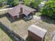 Home features a fenced backyard, shed and screened patio at 1606 Bismarck Dr, Deltona, FL 32725