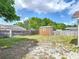 Backyard view features a wood storage shed and wooden fence at 1606 Bismarck Dr, Deltona, FL 32725