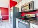 Modern kitchen featuring stainless steel appliances, stylish counters, and convenient layout at 1606 Bismarck Dr, Deltona, FL 32725