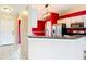 Open-concept kitchen featuring modern appliances and a view into the living area at 1606 Bismarck Dr, Deltona, FL 32725