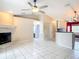 Open floor plan with white tile throughout the kitchen, dining, and living areas at 1606 Bismarck Dr, Deltona, FL 32725