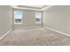 Spacious bedroom with neutral carpet, dual windows, and ample natural light at 16217 Prairie School Dr, Winter Garden, FL 34787