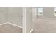 Spacious carpeted bedroom with ample natural light and a walk-in closet with wire shelving at 16217 Prairie School Dr, Winter Garden, FL 34787