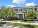 Charming two-story townhome with a welcoming front porch and well-maintained landscaping at 16217 Prairie School Dr, Winter Garden, FL 34787