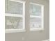 Interior view of two sunny windows with white trim and window treatments at 16217 Prairie School Dr, Winter Garden, FL 34787