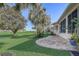 Spacious backyard with mature trees and lush green grass at 1900 Nw 57Th Ct, Ocala, FL 34482