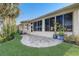 Backyard patio and large windows offer a relaxing outdoor living and views at 1900 Nw 57Th Ct, Ocala, FL 34482