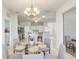 Dining area with chandelier lighting and easy access to the kitchen, great for entertaining at 1900 Nw 57Th Ct, Ocala, FL 34482