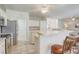 Open concept kitchen featuring a breakfast bar, stainless steel appliances, and tiled backsplash at 1900 Nw 57Th Ct, Ocala, FL 34482