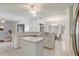 Bright kitchen featuring stainless steel appliances, tile floors, and open to a living room at 1900 Nw 57Th Ct, Ocala, FL 34482