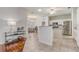 Eat in kitchen featuring stainless steel appliances, white cabinets and breakfast bar at 1900 Nw 57Th Ct, Ocala, FL 34482