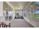 Comfortable sunroom featuring large sliding glass doors and outdoor views at 1900 Nw 57Th Ct, Ocala, FL 34482
