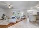 Bright living room with hardwood floors and a ceiling fan at 1900 Nw 57Th Ct, Ocala, FL 34482
