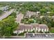 Aerial view of the property surrounded by lush trees and a community pool at 200 Maitland Ave # 52, Altamonte Springs, FL 32701