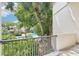 Balcony with a view of a swimming pool, greenery and trees at 200 Maitland Ave # 52, Altamonte Springs, FL 32701