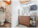 Bathroom featuring tiled floors, a wooden vanity, and a shower with floral curtains at 200 Maitland Ave # 52, Altamonte Springs, FL 32701