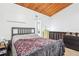 Cozy bedroom with hardwood floors and an eye-catching wood plank ceiling at 200 Maitland Ave # 52, Altamonte Springs, FL 32701