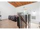 Lofted bedroom featuring exposed wood ceilings and ensuite bathroom at 200 Maitland Ave # 52, Altamonte Springs, FL 32701