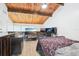 Spacious lofted bedroom featuring exposed wood ceiling and tile floors at 200 Maitland Ave # 52, Altamonte Springs, FL 32701