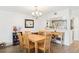 Cozy dining room featuring wood-look tile flooring and an open view to the kitchen at 200 Maitland Ave # 52, Altamonte Springs, FL 32701