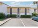 Condo exterior with parking, updated facade, manicured hedges, and convenient unit numbers at 200 Maitland Ave # 52, Altamonte Springs, FL 32701