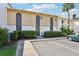 Condo exterior with parking, updated facade, manicured hedges, and convenient unit numbers at 200 Maitland Ave # 52, Altamonte Springs, FL 32701