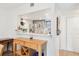 Breakfast bar with view to kitchen featuring stainless appliances and granite countertops at 200 Maitland Ave # 52, Altamonte Springs, FL 32701