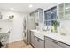 Stainless steel refrigerator and sink in an updated kitchen with grey cabinets at 200 Maitland Ave # 52, Altamonte Springs, FL 32701