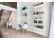 Living area with sleek desk space, shelving and staircase at 200 Maitland Ave # 52, Altamonte Springs, FL 32701