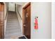 Interior stairwell with neutral carpet, wood trim, and a visible apartment door with hardware at 200 Maitland Ave # 52, Altamonte Springs, FL 32701