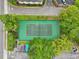Aerial view of a well-maintained tennis court surrounded by lush greenery and convenient parking at 200 Maitland Ave # 52, Altamonte Springs, FL 32701