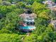 Lushly landscaped estate with a pool and outdoor seating areas at 2001 Bett Mar Ln, Winter Park, FL 32789