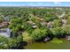Large property with lake access featuring a private pool and a park-like lawn at 2001 Bett Mar Ln, Winter Park, FL 32789