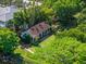 A beautiful aerial view of the home and its surrounding lush landscape at 2001 Bett Mar Ln, Winter Park, FL 32789