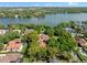 Waterfront house surrounded by lush trees and overlooking a large lake at 2001 Bett Mar Ln, Winter Park, FL 32789
