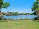 Spacious backyard with well-maintained lawn and a picturesque view of the lake at 2001 Bett Mar Ln, Winter Park, FL 32789
